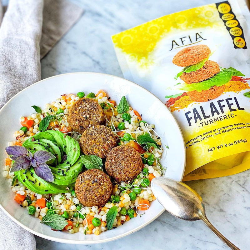 A pearl couscous bowl made from our recipe featuring Afia Falafel. 