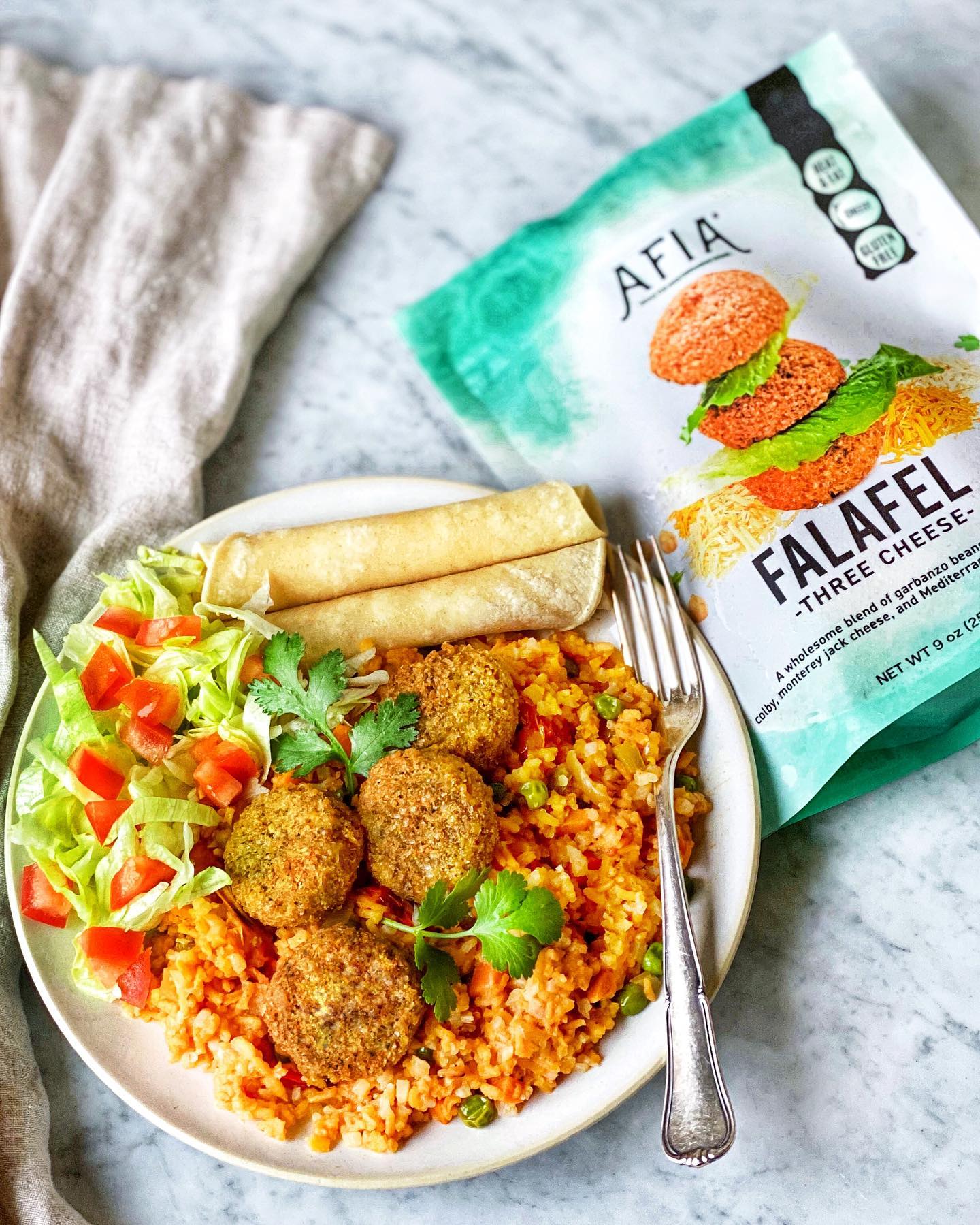 Plate with 3 cheese Tex-Mex featuring Afia Falafel.