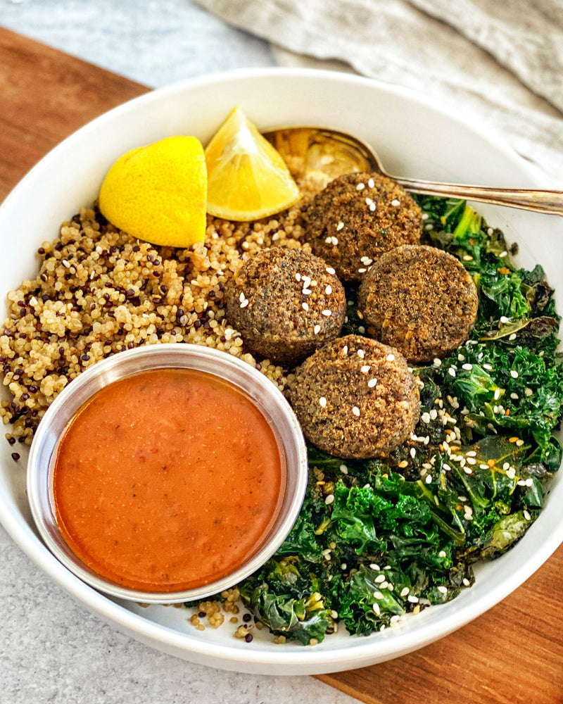 Garlic Herb Falafel Bowl With Sautéed Kale Quinoa and lemon