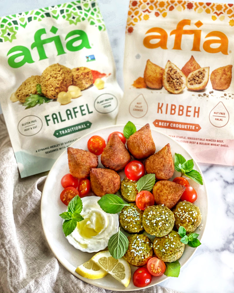 Snack platter with fresh vegetables with Lebneh dip and Afia Kibbeh. 