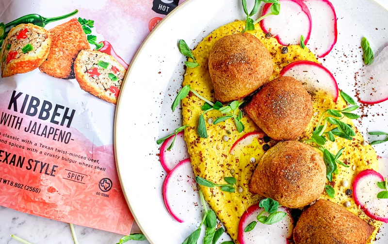 Hummus platter topped with Afia Spicy Jalapeno Kibbeh
