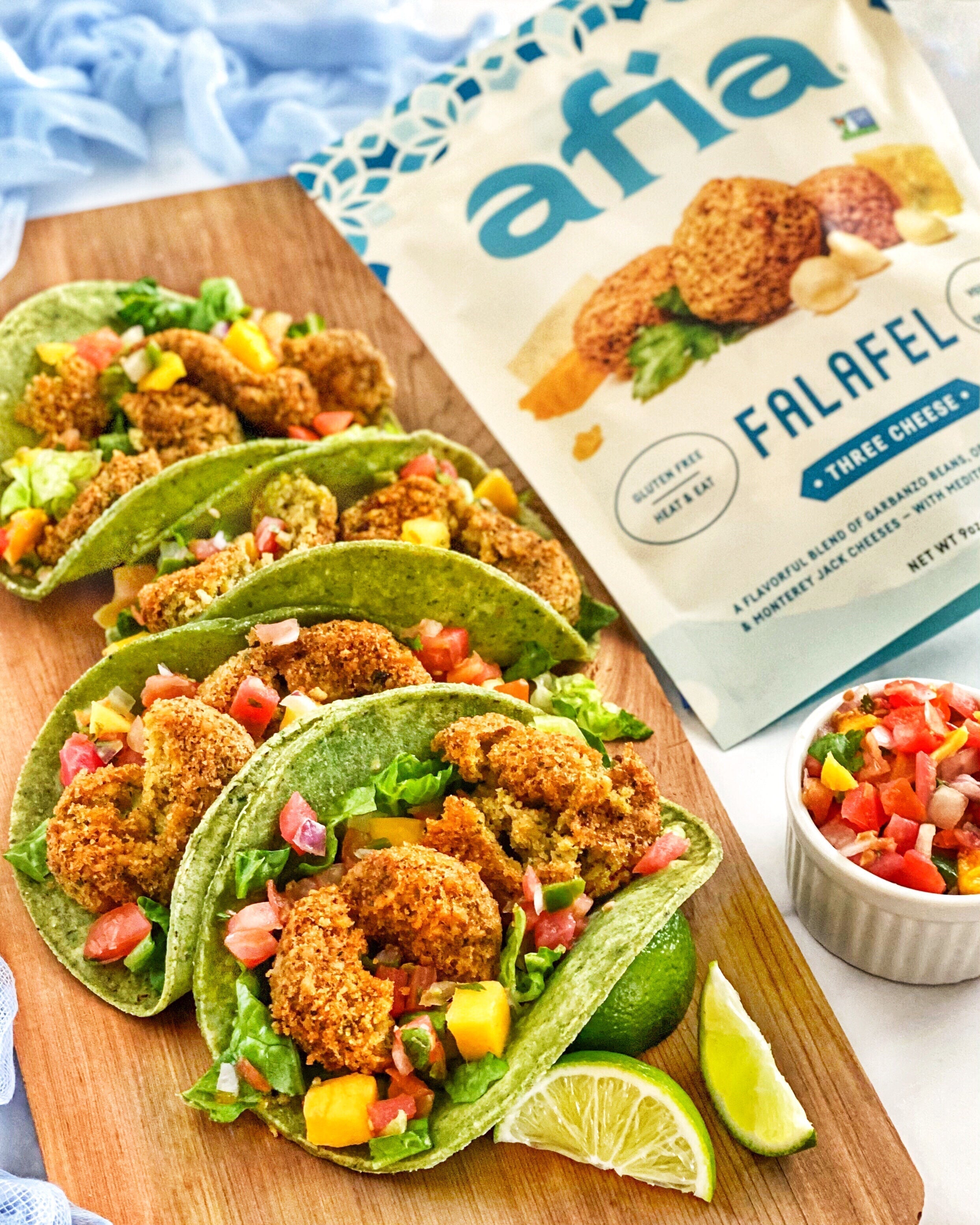 Tacos made with three cheese Afia frozen falafel, topped with mango salsa.