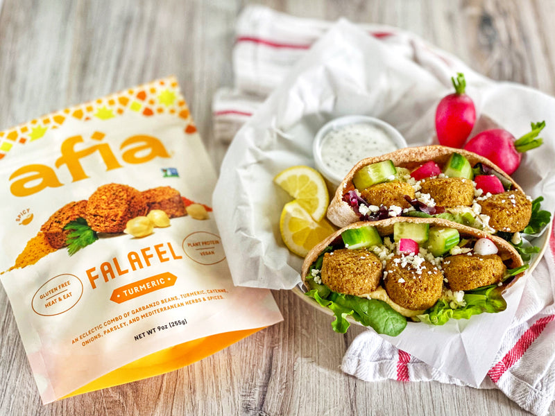 Turmeric Falafel Pita next to a bag of Afia Falafel