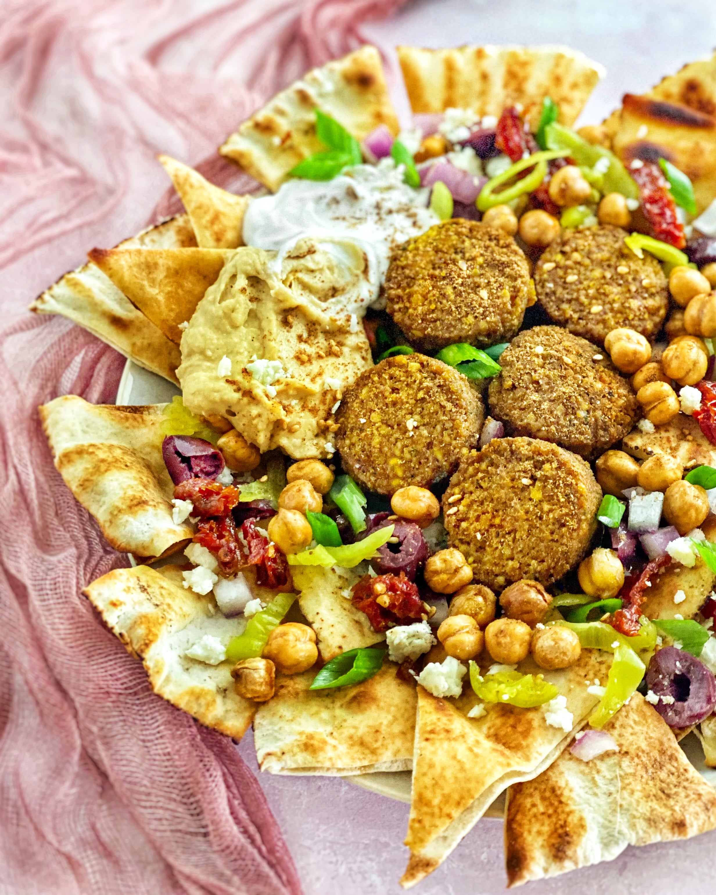 Turmeric Afia Falafel on a plate of vegetarian nachos