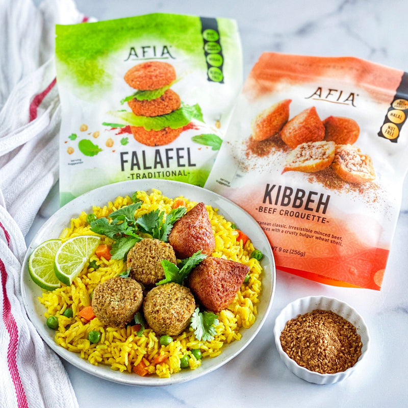 Turmeric coconut rice topped with Afia Falafel or Kibbeh.