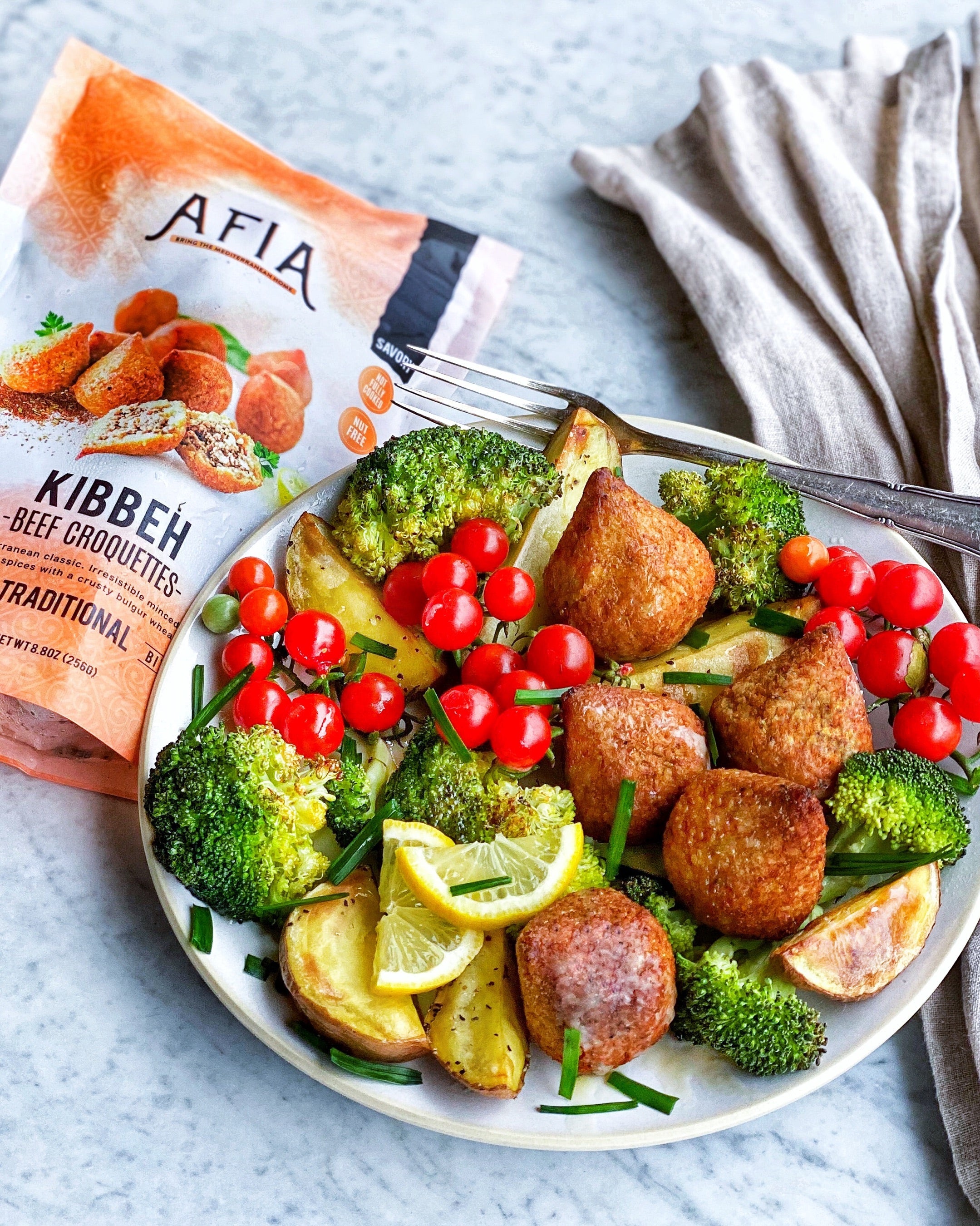 Vegetable bowl topped with Afia Kibbeh