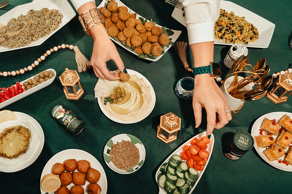 table of Afia mediterranean food, falafel, falafel rice bowls, kibbeh