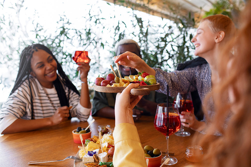 table of friends around mediterranean food