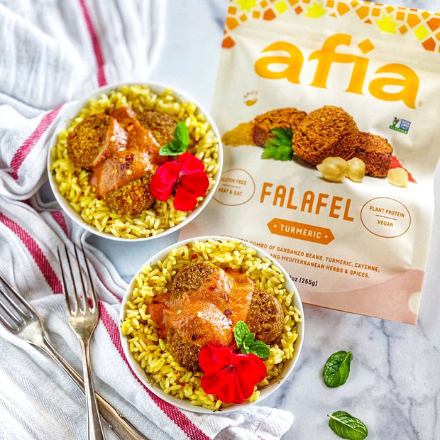 Rice bowls featuring Afia Turmeric Falafel. 